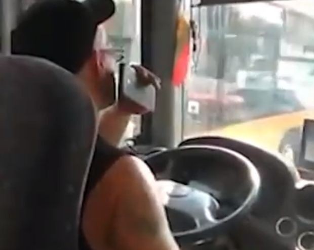 A public transport driver drinks though driving travellers