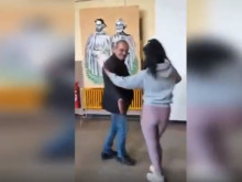 Скандално видео взриви интернет: Директор на училище вихри кючек пред портрета на Кирил и Методий